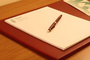 a pen sitting on top of a piece of paper at Hotel Iris in Genoa