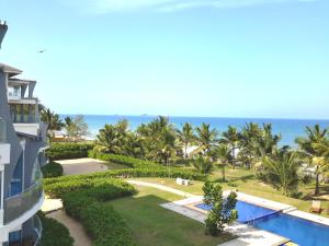 a view of the ocean from the balcony of a resort at Nilaveli Ocean Front Luxury Apartments in Trincomalee