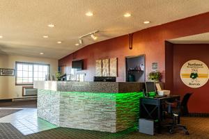 a lobby of a hotel with a stone counter top at Bearcat Inn and Suites in Maryville