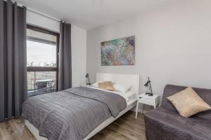 Posteľ alebo postele v izbe v ubytovaní Chill Apartments Wolska 45