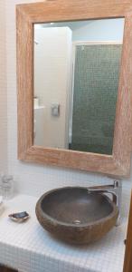 a bathroom with a sink with a large mirror at Boutique Hotel Placa in Krk
