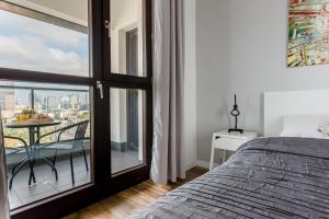Posteľ alebo postele v izbe v ubytovaní Chill Apartments Wolska 45