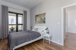 Posteľ alebo postele v izbe v ubytovaní Chill Apartments Wolska 45