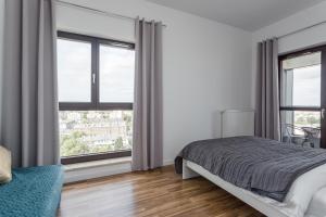 Posteľ alebo postele v izbe v ubytovaní Chill Apartments Wolska 45