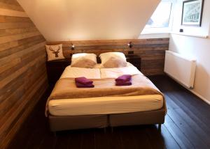 Postel nebo postele na pokoji v ubytování De Nussi's chalet 2