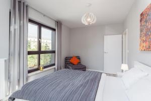 Posteľ alebo postele v izbe v ubytovaní Chill Apartments Wolska 45
