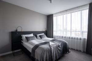 Postel nebo postele na pokoji v ubytování Reykjavik Residence Apartment Hotel