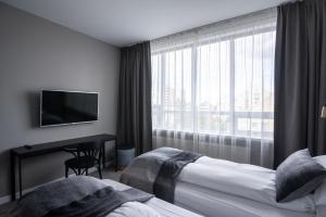 Postel nebo postele na pokoji v ubytování Reykjavik Residence Apartment Hotel