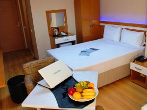 Postel nebo postele na pokoji v ubytování Avcılar İnci Hotel