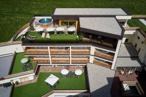 Κήπος έξω από το Hotel Sassongher