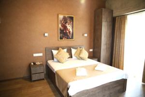 Voodi või voodid majutusasutuse Magic Hotel toas
