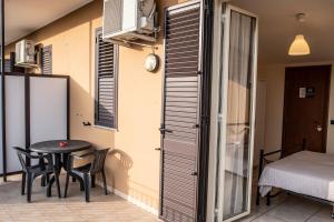 Postel nebo postele na pokoji v ubytování B&B Caravello