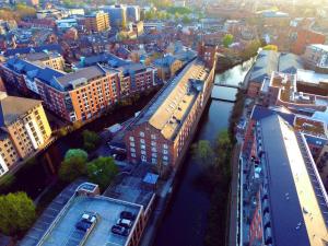 an overhead view of a city with a river and buildings at I Should Cocoa (York) - Seebohm in York