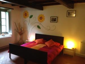 Postel nebo postele na pokoji v ubytování Agriturismo Le Dogane