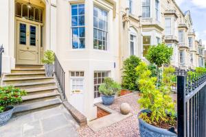 an exterior view of a house with plants at Luxury Apartments - 22 Garden Flat in Cheltenham