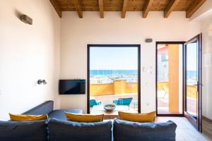 a living room with a couch and a table at ecoGrusApartments in El Masnou