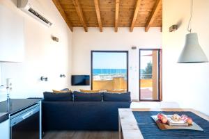 a living room with a couch and a table at ecoGrusApartments in El Masnou