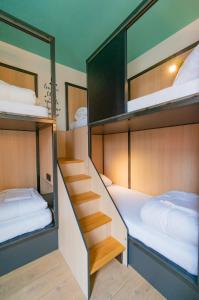 
a bedroom with a bed and a desk at Sparks Hostel in Rotterdam
