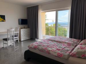 Postel nebo postele na pokoji v ubytování Apartments Diana