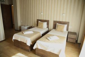 Voodi või voodid majutusasutuse Magic Hotel toas
