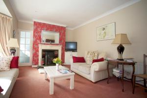 a living room with a couch and a fireplace at Glen na Smole in Wicklow