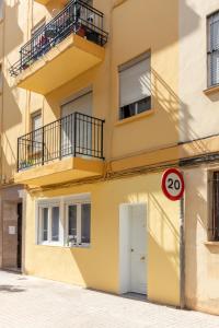 a building with a number sign in front of it at Apartamentos Navío in Valencia