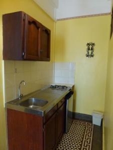 a kitchen with a sink and a counter top at Residencial La Fonte in Santo Domingo