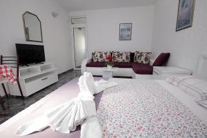 Postel nebo postele na pokoji v ubytování Apartments Kruna Jovanović