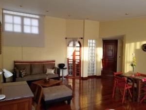 a living room with a couch and a table at Entire Studio-Penthouse De Luxe in Lima
