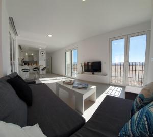 a living room with a couch and a table at ecoSmart Apartments Granada in Granada