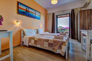 Postel nebo postele na pokoji v ubytování Marilena Apartments & Studios