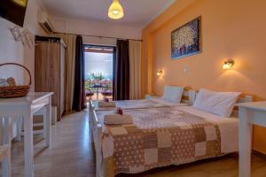 Postel nebo postele na pokoji v ubytování Marilena Apartments & Studios
