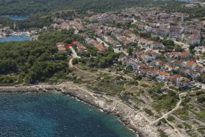 an aerial view of a town on the shore of the water at Apartments Nevenka in Mali Lošinj