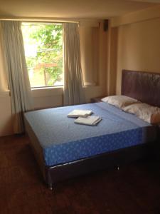 Een bed of bedden in een kamer bij Isla Francia