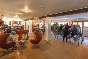 a group of people sitting in a restaurant at Discovery Resorts - Glen Helen in Glen Helen