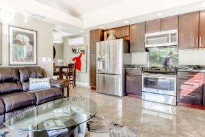 a kitchen with a couch and a glass table at Apricot Ridge in East Wenatchee
