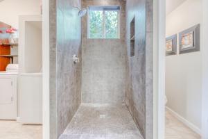 a shower with a glass door in a bathroom at Apricot Ridge in East Wenatchee
