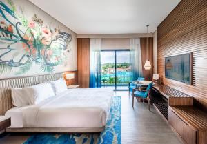 a hotel room with a bed and a desk at Hard Rock Hotel Desaru Coast in Desaru +37 photos