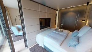 Postel nebo postele na pokoji v ubytování White Pearl Apartment 1.04