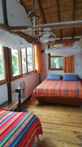 Letto o letti in una camera di Hostería Mandála