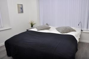 Postel nebo postele na pokoji v ubytování AB Centrum Aarhus Bed without Breakfast + 3 fotografie