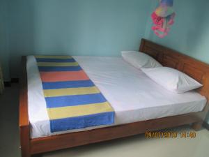 Letto o letti in una camera di Rathna Gems Halt