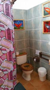 
a bathroom with a toilet, sink, and bathtub at Hostería Mandála in Puerto López
