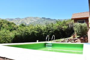 a swimming pool with a view of the mountains at Chalet Tornasol in El Rincón