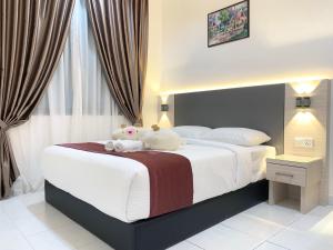 Voodi või voodid majutusasutuse Langkawi Cozy Holiday Home at Taman Seri Aman by Zervin toas