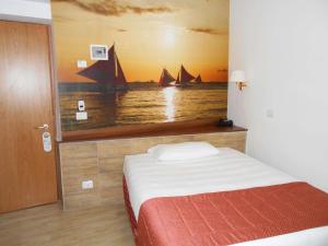 Postel nebo postele na pokoji v ubytování Hotel Riviera Fiumicino