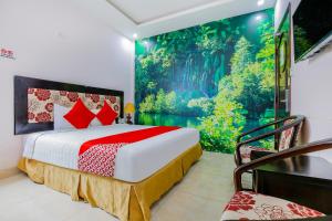 A bed or beds in a room at Areca Riverside Đà Nẵng