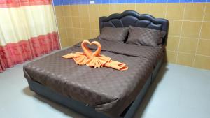 Een bed of bedden in een kamer bij D5 Hotel สาขา มาบโป่ง