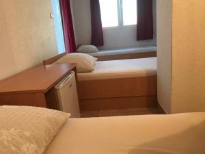 Postel nebo postele na pokoji v ubytování Royal Apartments