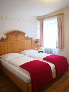 Postel nebo postele na pokoji v ubytování Landhotel Postgut - Tradition seit 1549